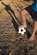 Photo: Let's play football! Boy with ball on village road Let's play football! Boy with ball on village road