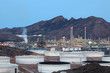 Oil refinery facilities illuminated at dusk