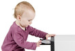 young child playing with CD