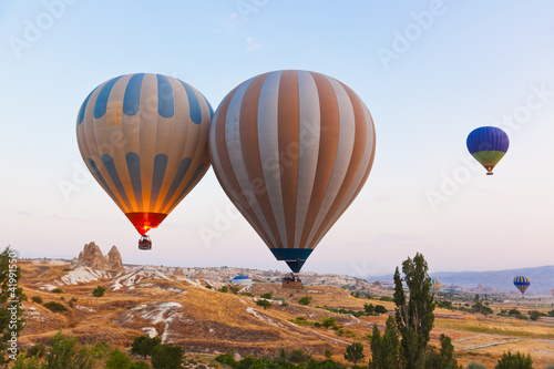 Photo: Hot air balloon flying over Cappadocia Turkey Hot air balloon flying over Cappadocia Turkey