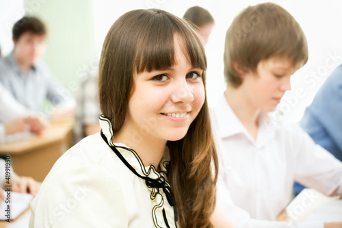 Photo: Schoolgirl in the classroom Schoolgirl in the classroom