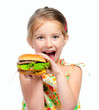 Photo: little girl eating a sandwich isolated little girl eating a sandwich isolated