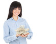 Photo: Young business woman with pile of money Young business woman with pile of money