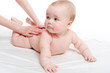 Mother massaging her lovely baby