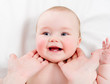 Mother massaging her lovely baby