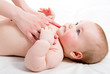 Mother massaging her lovely baby
