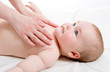 Mother massaging her lovely baby
