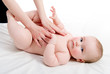 Mother massaging her lovely baby
