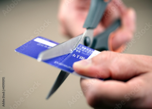 Photo: Cutting a credit card Cutting a credit card