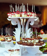 Foto: many servings of sweet tasty dessert on buffet many servings of sweet tasty dessert on buffet