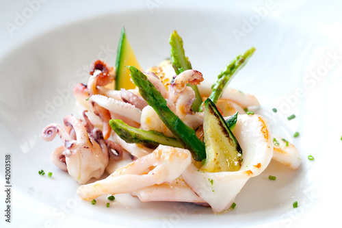 Photo: Grilled calamari with green asparagus. Grilled calamari with green asparagus.
