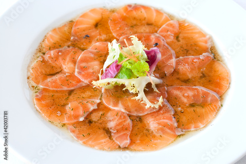 Photo: Smoked salmon carpaccio dish. Smoked salmon carpaccio dish.