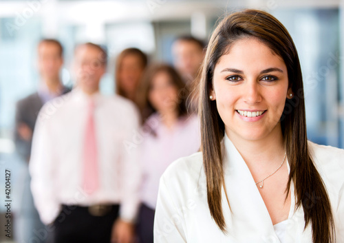 Photo: Woman leading business team Woman leading business team