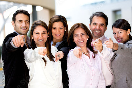 Photo: Business group pointing Business group pointing