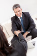 Foto: Mature businessman at the interview Mature businessman at the interview