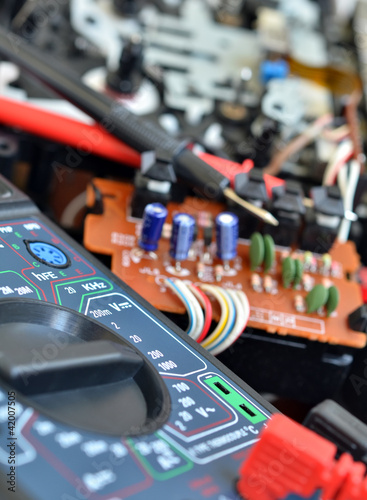 Photo: Technology background, digital multimeter close up Technology background, digital multimeter close up