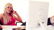 Vídeo: young blonde woman working with computer, over white background young blonde woman working with computer, over white background