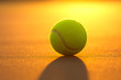 Photo: Tennis Ball on the Court at Sunset Tennis Ball on the Court at Sunset