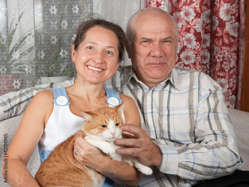 Photo: Elderly couple with pet Elderly couple with pet