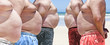 Five very obese fat men on the beach
