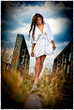 Photo: a sensual walking girl with white dress on the railway a sensual walking girl with white dress on the railway