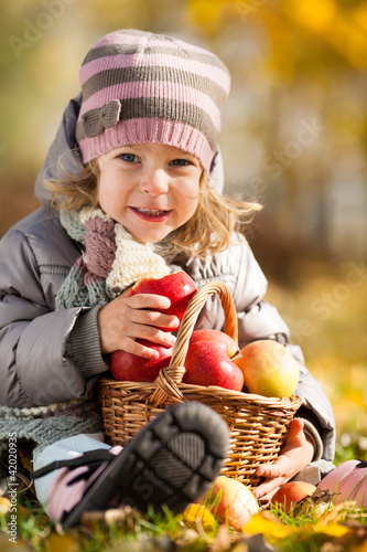 Photo: Child with basket of apples Child with basket of apples
