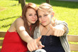 thumbs up - teenager girls sharing music