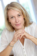 Portrait of blond mature woman relaxing in sofa