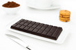 Chocolate dark tablet, cocoa, cookies on white tablecloth Chocolate dark tablet, cocoa, cookies on white tablecloth