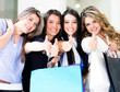 Shopping women with thumbs up