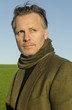 mature man with beard wearing scarf