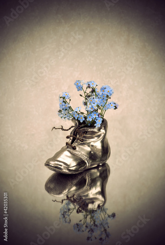 Photo: Antique vase with blue flowers Antique vase with blue flowers