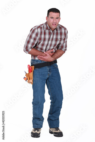 Photo: man having stomachache man having stomachache