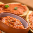 Fresh homemade tomato-butter spread in small bowl