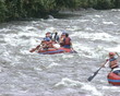 rubber boats ride down wildwater river. Extreme tourist trip