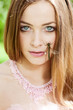 Woman with a dragonfly on her face