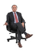 Businessman sitting in a swivel chair
