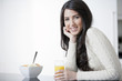 Young woman enjoying breakfast