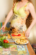 pregnant woman s hands on kitchen with healthy food