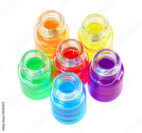 Photo: Six small opened bottles of different colored aromatic oils Six small opened bottles of different colored aromatic oils