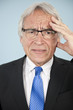 Foto: worried businessman with headache worried businessman with headache