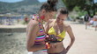Video: Two female friends using tablet computer on summer vacation Two female friends using tablet computer on summer vacation