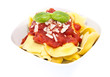 Tortellini in a bowl isolated on white