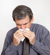 Man with a Nosebleed or Cold Wiping Nose