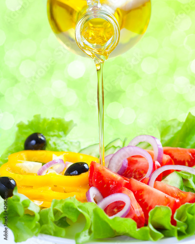 Photo: Healthy lifestyle. Fresh salad with oil. Food still life. Healthy lifestyle. Fresh salad with oil. Food still life.