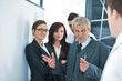 Small business team in the office in front of a board