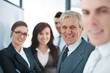 Small business team in the office in front of a whiteboard