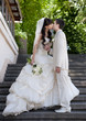 Photo: happy bride and groom at a park on their wedding day happy bride and groom at a park on their wedding day