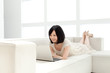 Beautiful young woman using a laptop computer