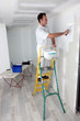 Photo: Man painting a wall Man painting a wall